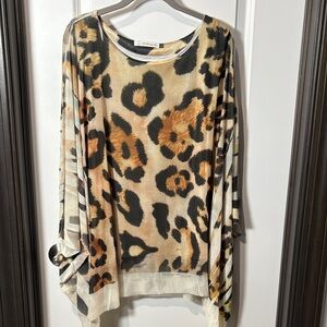 Leopard Patterned Women's Blouse. - NWOT
Sheer overlay.